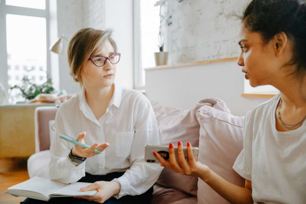 Therapist talking to patient